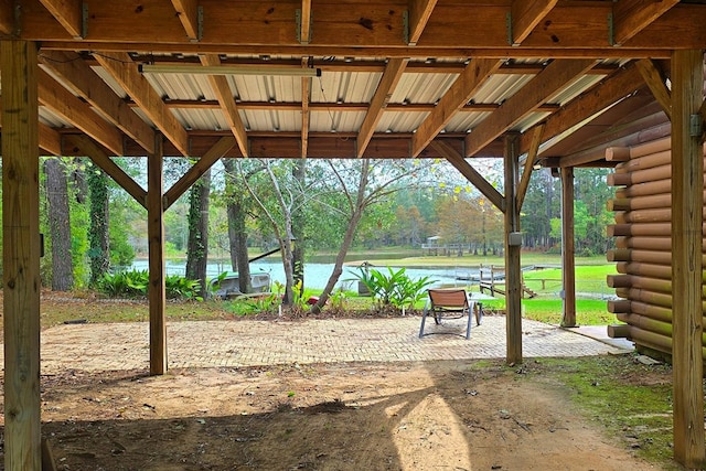 view of home's community with a water view and a patio