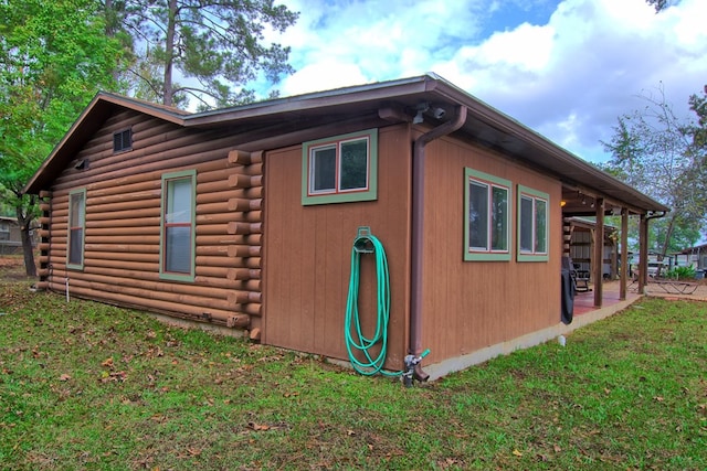 view of property exterior with a yard