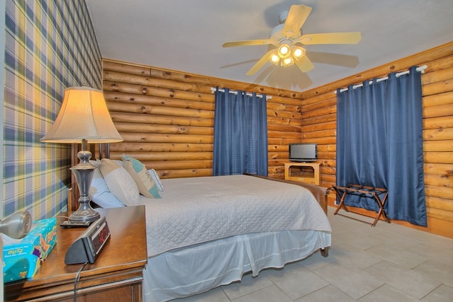 bedroom featuring ceiling fan and log walls