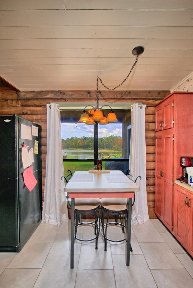 dining space with rustic walls and light tile patterned flooring