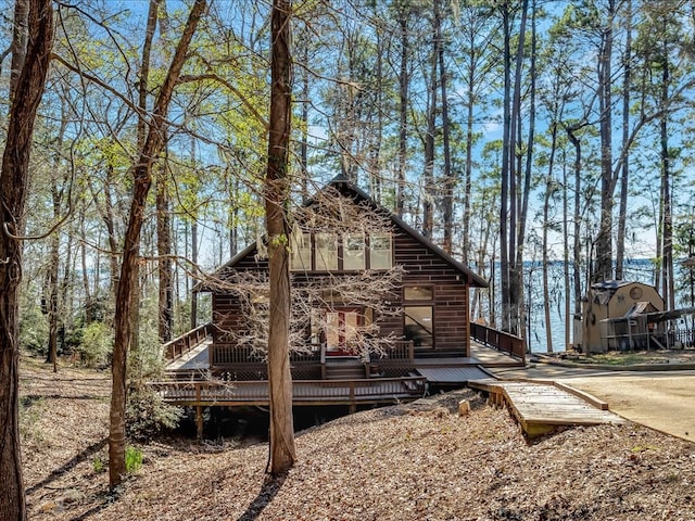 view of side of home featuring a wooden deck