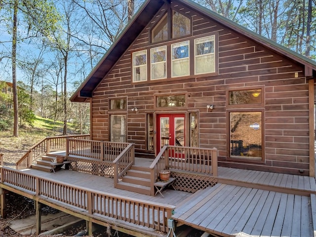 back of property featuring a deck and french doors