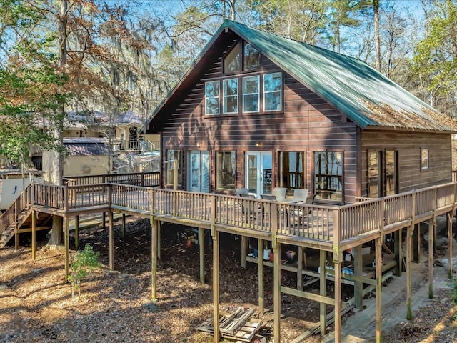 rear view of property with a wooden deck