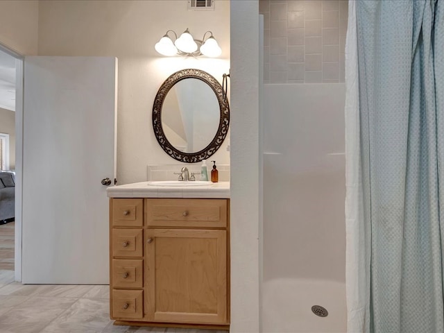 bathroom featuring a shower with curtain and vanity