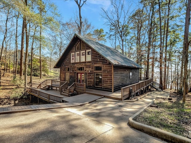 exterior space featuring a wooden deck