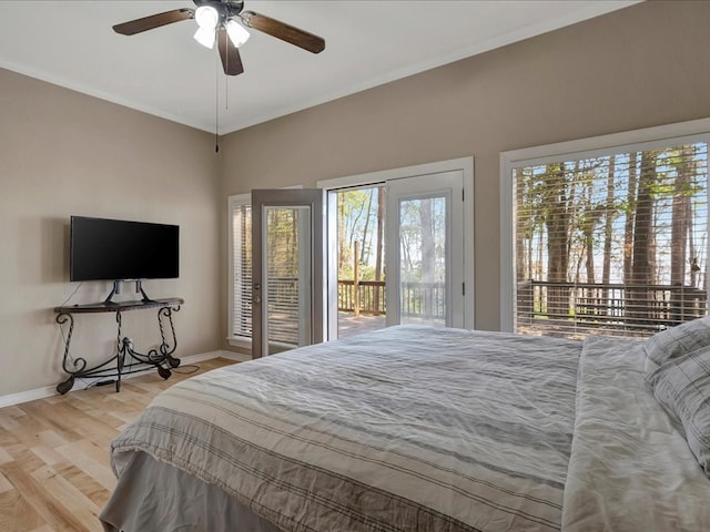 bedroom featuring access to outside, light hardwood / wood-style floors, and ceiling fan