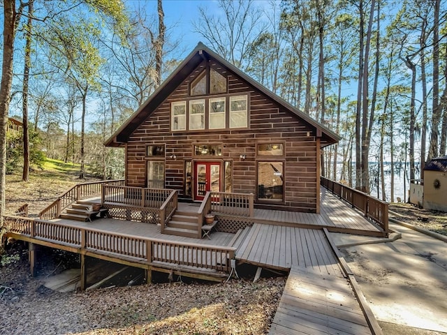 back of property featuring a wooden deck