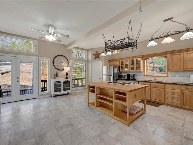 kitchen with plenty of natural light, stainless steel appliances, and french doors