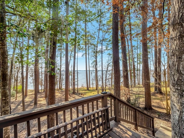 wooden terrace with a water view