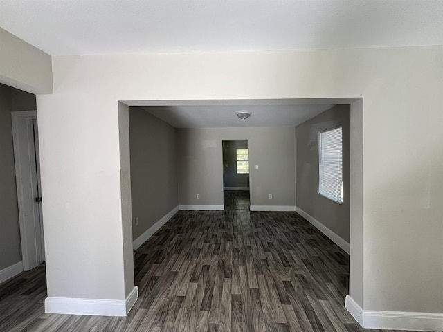 empty room featuring dark hardwood / wood-style flooring