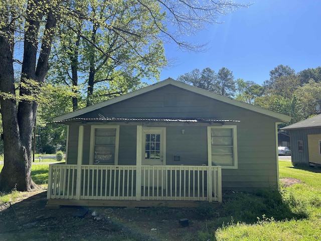 view of home's exterior featuring covered porch