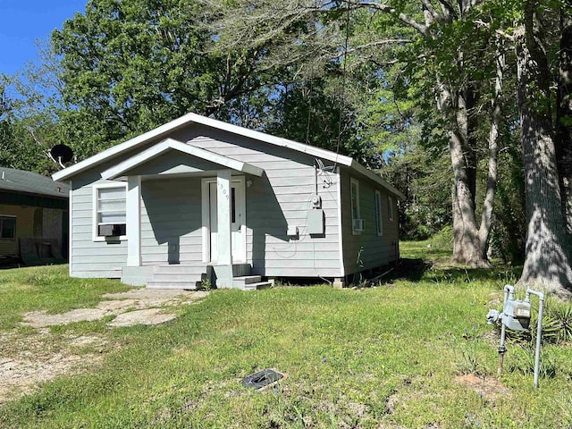 bungalow with a front yard