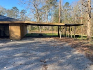 view of outbuilding featuring a carport