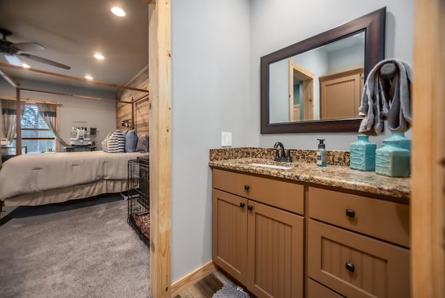 ensuite bathroom featuring recessed lighting, ensuite bathroom, ceiling fan, and vanity