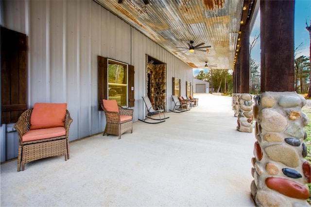 view of patio featuring an outbuilding and ceiling fan