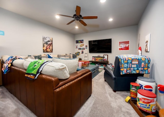 living area featuring recessed lighting, light colored carpet, and a ceiling fan