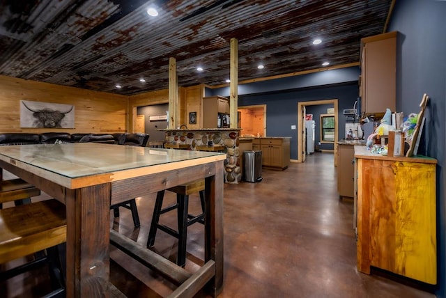 dining area featuring recessed lighting and concrete floors