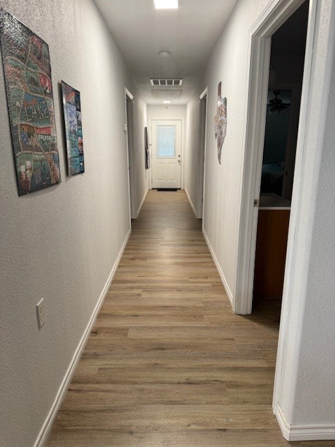 hallway featuring light wood-type flooring