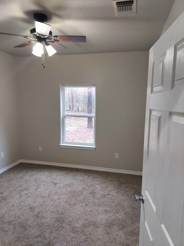 carpeted empty room with ceiling fan