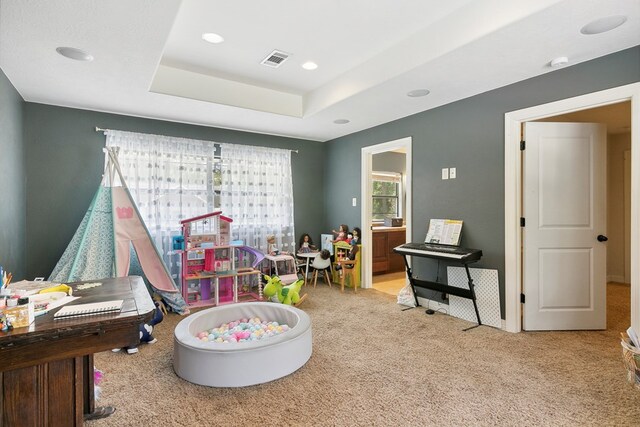 1025 Creek Bend Dr, Jasper, TX 75951 - playroom featuring carpet, a raised ceiling, and recessed lighting