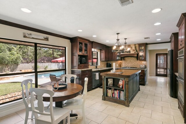 1025 Creek Bend Dr, Jasper, TX 75951 - kitchen featuring dishwasher, premium range hood, ornamental molding, gas cooktop, and a center island