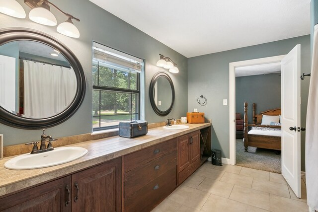 1025 Creek Bend Dr, Jasper, TX 75951 - full bath with ensuite bathroom, double vanity, and tile patterned floors