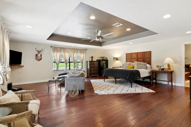 1025 Creek Bend Dr, Jasper, TX 75951 - bedroom with a tray ceiling, hardwood / wood-style flooring, and recessed lighting