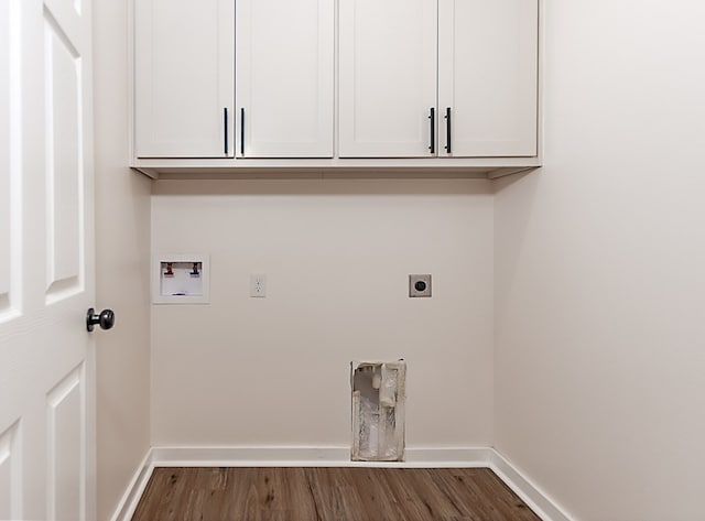 washroom with washer hookup, electric dryer hookup, dark hardwood / wood-style floors, and cabinets