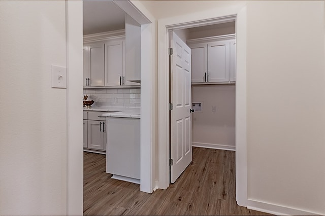 hall with wood-type flooring