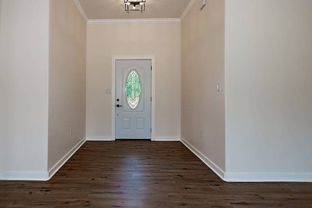 entrance foyer featuring dark wood-type flooring and ornamental molding