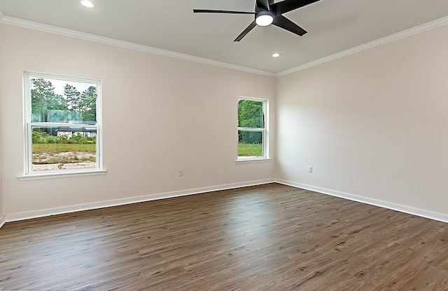 unfurnished room featuring plenty of natural light, ceiling fan, crown molding, and dark wood-type flooring