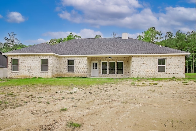 rear view of house featuring ceiling fan