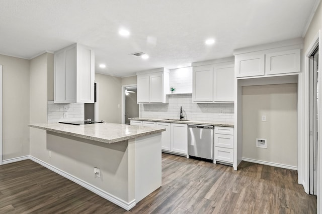 kitchen featuring sink, dishwasher, dark hardwood / wood-style floors, light stone counters, and white cabinets