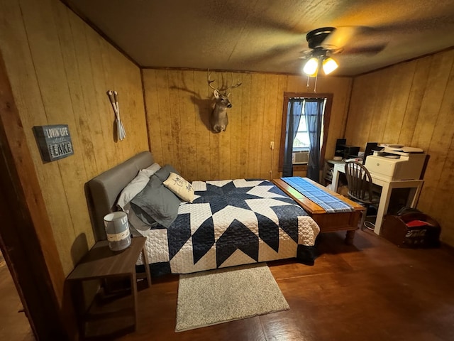 bedroom with wooden walls and ceiling fan