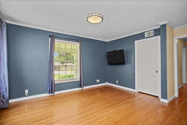 715 Pine Tree Ln, Lufkin, TX 75904 - spare room with wood finished floors, ornamental molding, and baseboards