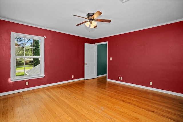 715 Pine Tree Ln, Lufkin, TX 75904 - empty room featuring wood finished floors, baseboards, a ceiling fan, and crown molding