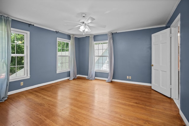715 Pine Tree Ln, Lufkin, TX 75904 - spare room with ceiling fan, light wood-type flooring, baseboards, and ornamental molding