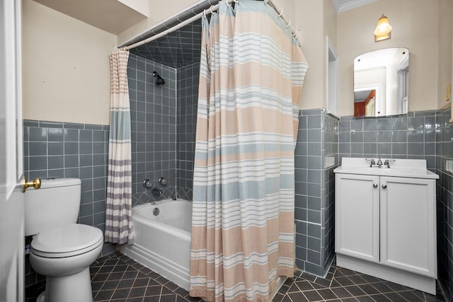715 Pine Tree Ln, Lufkin, TX 75904 - full bathroom with tile walls, tile patterned floors, toilet, shower / bathtub combination with curtain, and vanity