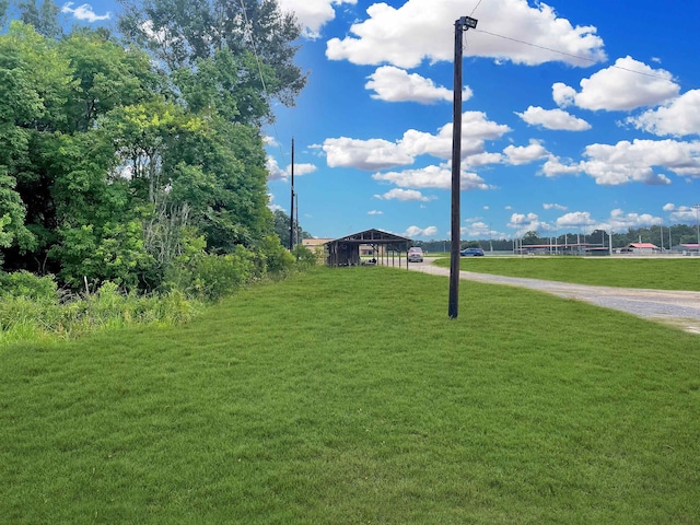 view of property's community with a lawn