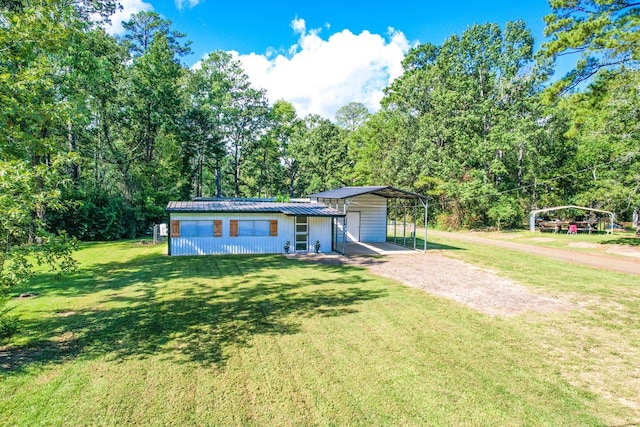 view of front of house featuring a front yard and a carport