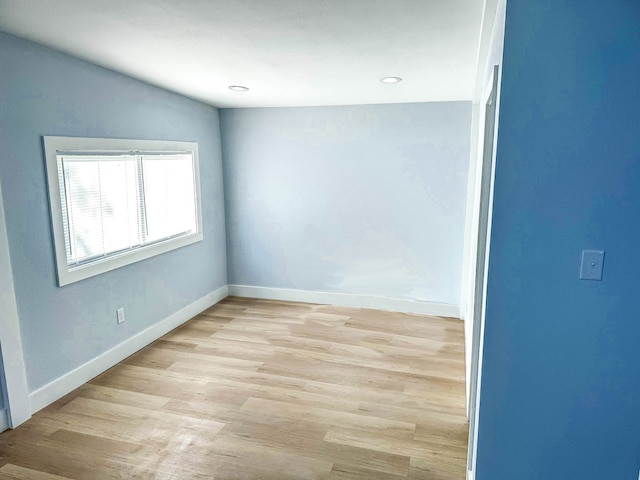 spare room featuring light hardwood / wood-style floors