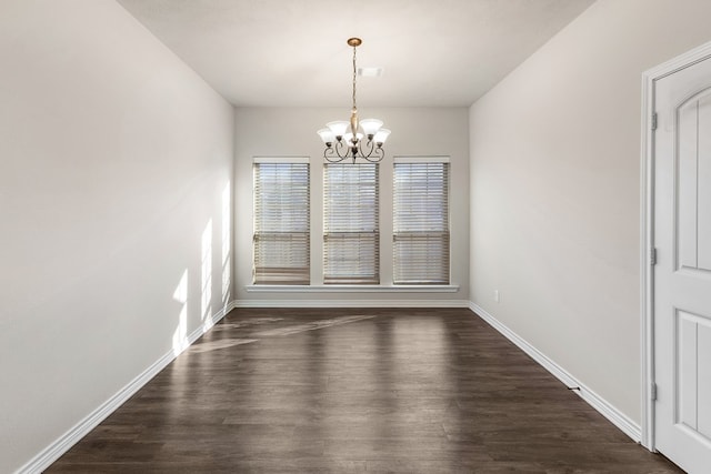 801 Dove Run Trl, College Station, TX 77845 - unfurnished dining area featuring dark wood-style flooring and a chandelier