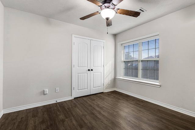 801 Dove Run Trl, College Station, TX 77845 - unfurnished bedroom with wood finished floors, a closet, and a ceiling fan