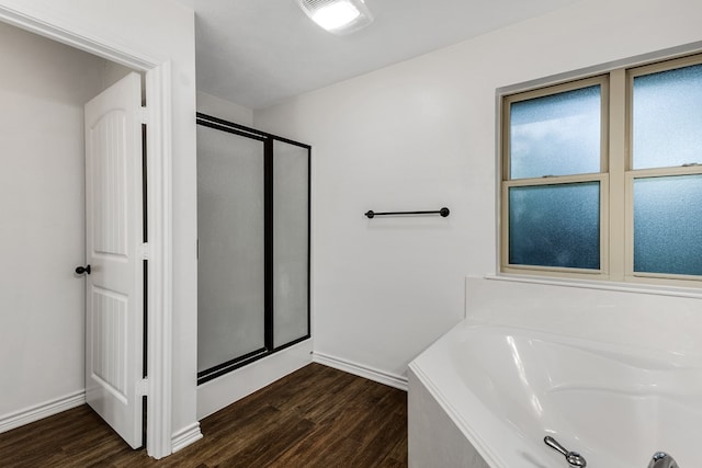 801 Dove Run Trl, College Station, TX 77845 - full bathroom with a shower stall, wood finished floors, and a garden tub