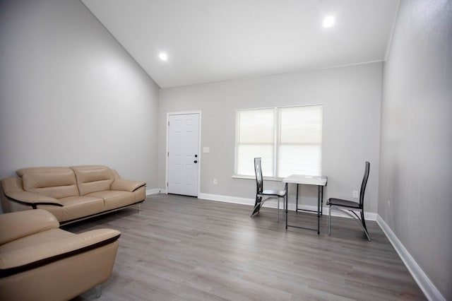 206 Shady Pnes, Lufkin, TX 75901 - living room featuring wood finished floors, baseboards, lofted ceiling, and recessed lighting