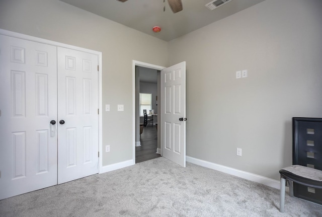206 Shady Pnes, Lufkin, TX 75901 - unfurnished bedroom featuring carpet floors, a closet, baseboards, and ceiling fan