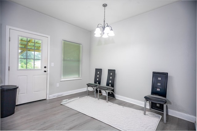206 Shady Pnes, Lufkin, TX 75901 - living area featuring a chandelier, wood finished floors, and baseboards