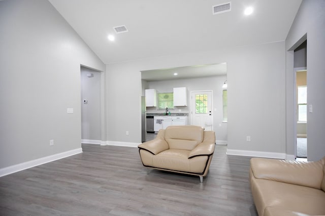 206 Shady Pnes, Lufkin, TX 75901 - living room featuring dark wood-style floors, baseboards, recessed lighting, and high vaulted ceiling
