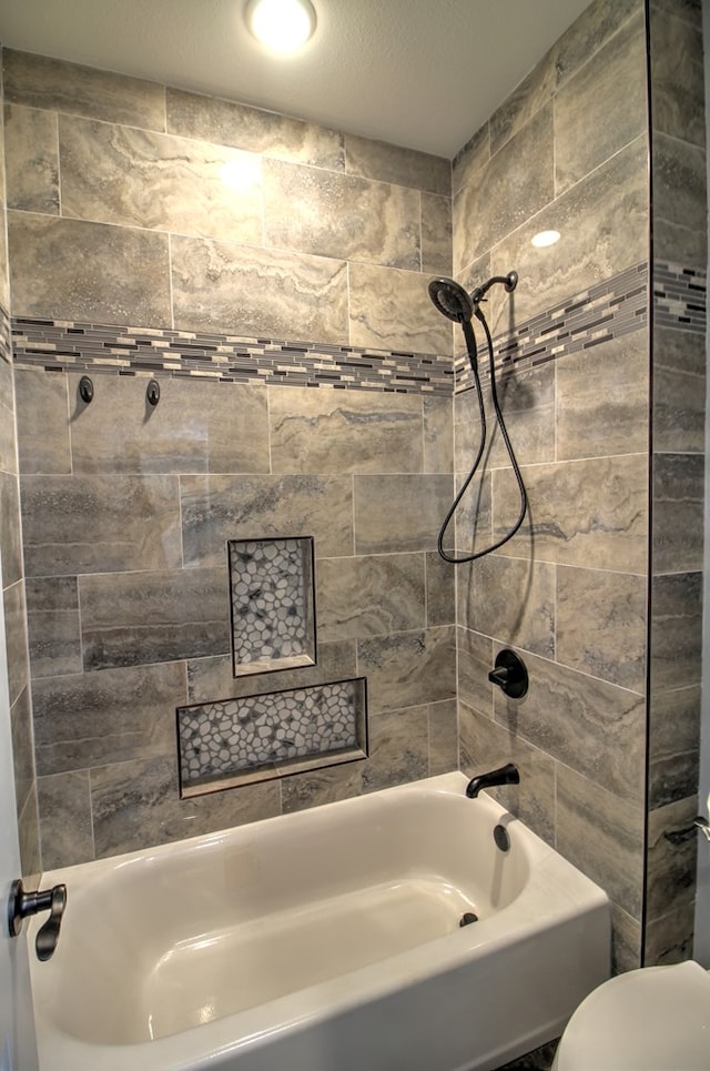 full bathroom featuring shower / bathing tub combination and toilet
