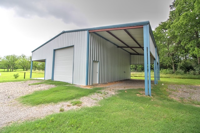view of outbuilding with driveway and an outdoor structure